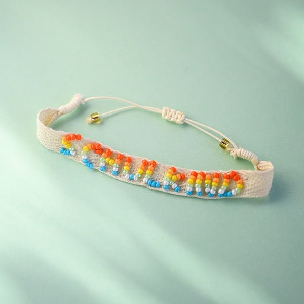 Ava & Yves Gewebtes Armband mit handgearbeiteter Stickerei Schulkind natur mit Säckchen - Sausebrause Shop